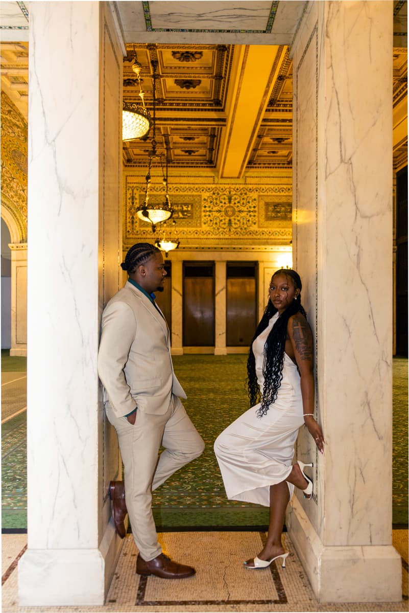 Karmyn and Anthony between columns